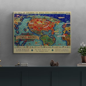 May include: A vintage map of the world with a colorful design, showing the continents and oceans. The map is titled "World Wide Short Wave Radio Map" and features the text "Stewart-Warner" in a banner at the bottom. The map is a promotional piece for Stewart-Warner radios.