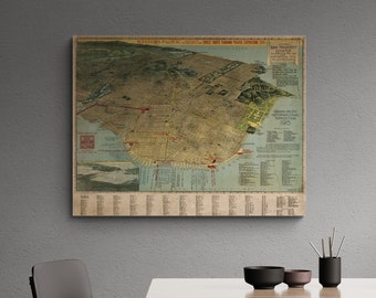 Puede incluir: Un mapa vintage de San Francisco de 1915, que muestra la disposición de la ciudad durante la Exposición Internacional Panamá-Pacífico. El mapa está impreso en papel envejecido con un fondo azul claro y presenta líneas rojas que indican calles y carreteras.
