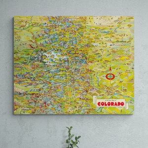 May include: A vintage illustrated map of Colorado, featuring a colorful depiction of the state's geography, including mountains, rivers, and cities. The map is titled "A Picture Map of Colorado" and includes the text "The State Playground of the Wide Wonderful West".