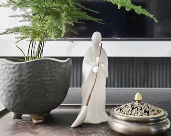 White Ceramic Sweeping Monk Statue: Zen Garden Decor