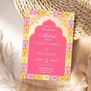 May include: A pink and orange Mehndi invitation with a decorative border. The invitation features an ornate archway with the text "PLEASE JOIN US FOR A Mehndi HONORING MAHNOOR AHMED & BILALQURESHI" and the date "SATURDAY 15 FEBRUARY 2025".
