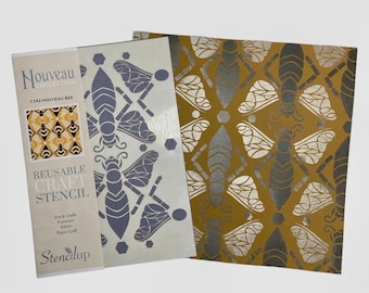 May include: A reusable craft stencil featuring a geometric pattern of bees. The stencil is made of a white plastic material and is designed for use with paint, ink, or other crafting materials. The stencil is shown on a white background with a sample of the design in gold on a brown background.