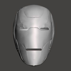 May include: A silver-colored, full-face helmet with a smooth, metallic finish. The helmet features eye and mouth openings, and is designed with angular lines and subtle curves. The overall design suggests a futuristic or superhero theme.