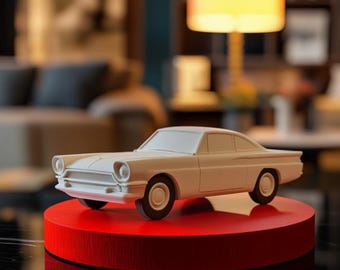 May include: A white model car on a red circular base. The car is a classic coupe with a long hood and a sleek design.