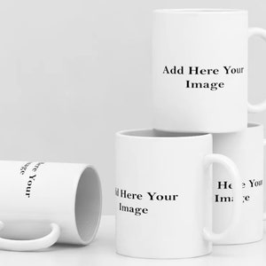 May include: Four white ceramic mugs with black text that reads "Add Here Your Image".
