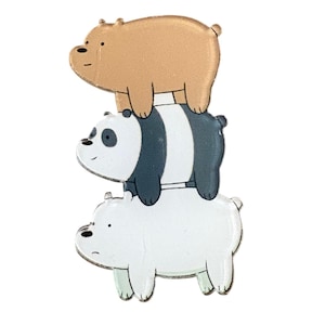 May include: A stacked pin featuring three cartoon bears. The top bear is tan, the middle bear is a panda with black and white markings, and the bottom bear is white. The bears are stacked on top of each other.