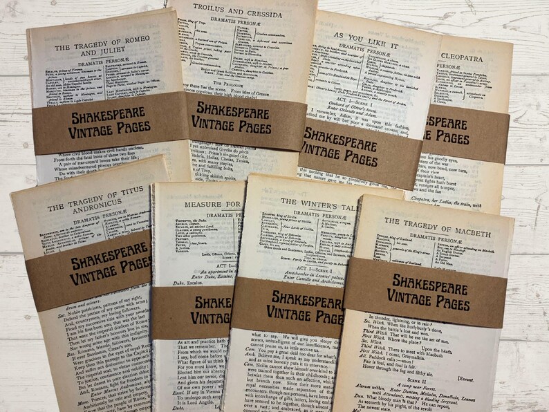 May include: A collection of vintage Shakespeare pages, each bound with a brown paper band that reads "Shakespeare Vintage Pages." The pages display text from various plays, including "Romeo and Juliet" and "Macbeth."