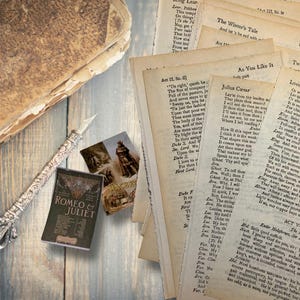 May include: An antique-style still life featuring a stack of aged paper pages with Shakespearean play excerpts, a miniature "Romeo & Juliet" book, a decorative pen, and vintage postcards. The scene is set on a weathered wooden surface.
