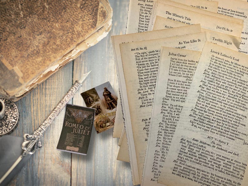 May include: An antique-style still life featuring a stack of aged paper pages with Shakespearean play excerpts, a miniature "Romeo & Juliet" book, a decorative pen, and vintage postcards. The scene is set on a weathered wooden surface.