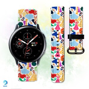 May include: A black smartwatch with a white watch face displaying the date "AUG 05" and the time "23°". The watch has a white band with a colorful pattern of Disney princesses. The band is made of leather and has a buckle closure.