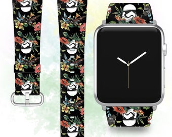 May include: A black Apple Watch band with a floral pattern featuring a white Stormtrooper helmet and colorful birds. The band is shown on a silver Apple Watch.