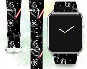 May include: Black and white Apple Watch band with a Star Wars theme. The band features Darth Vader, TIE fighters, and the Imperial symbol.