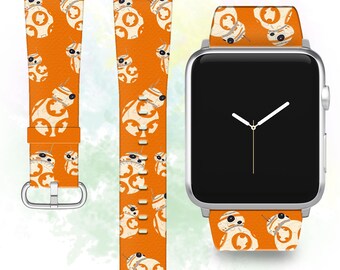 May include: Orange Apple Watch band with a repeating pattern of white BB-8 characters. The band is shown on a silver Apple Watch.
