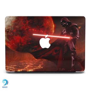 May include: A laptop skin featuring Darth Vader from Star Wars standing in front of a fiery red planet, holding a red lightsaber. The Apple logo is visible on the laptop.