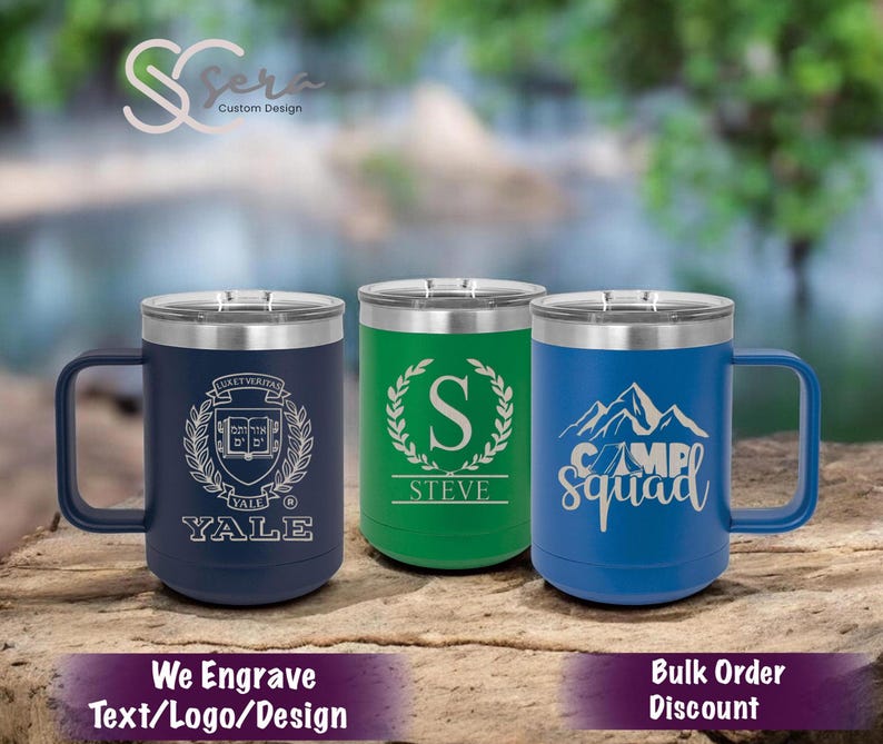 May include: Three stainless steel travel mugs with different engraved designs. The first mug is navy blue with a white Yale University logo. The second mug is green with a white letter S and the name Steve. The third mug is blue with a white mountain design and the text Camp Squad.