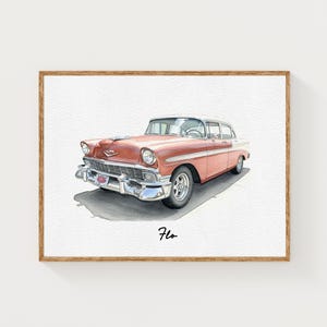 May include: Watercolor painting of a classic vintage car in a wooden frame. The car is a coral color with chrome accents and a white roof. The word "Flo" is written in cursive below the car.
