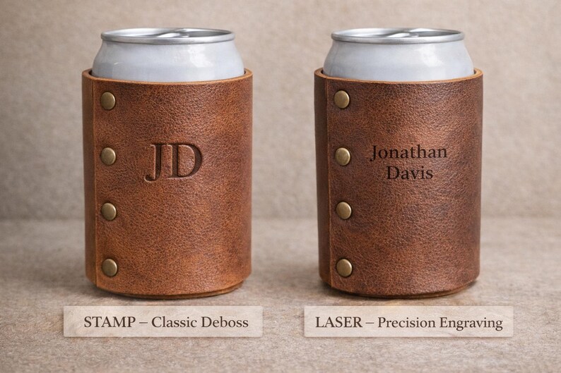 May include: Two brown leather can coolers, each holding a silver can. One cooler has "JD" debossed, the other has "Jonathan Davis" engraved. Both have brass rivets and the text "STAMP - Classic Deboss" and "LASER - Precision Engraving".