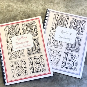 May include: Two spiral bound notebooks with a cream coloured background and black and white illustrations of letters. The notebooks have a red and grey border and the text "Spelling Bootcamp Student Notebook" on the front.