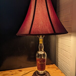 Weller bourbon whiskey lamp with metal base