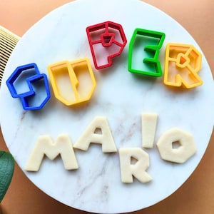 Super Mario Cookie Cutters Alphabet, Fondant Cutter, Buchstaben Ausstechform, Set mit 26 A-Z Buchstaben, Mario Schrift Zahlen Cutter