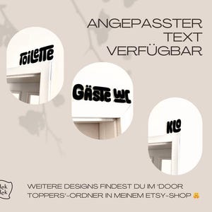 May include: Three black text door toppers with the words "Toilette", "G&auml;ste WC", and "Klo" on a light beige background. The text is in a bold, rounded font. The words are placed above doorways.