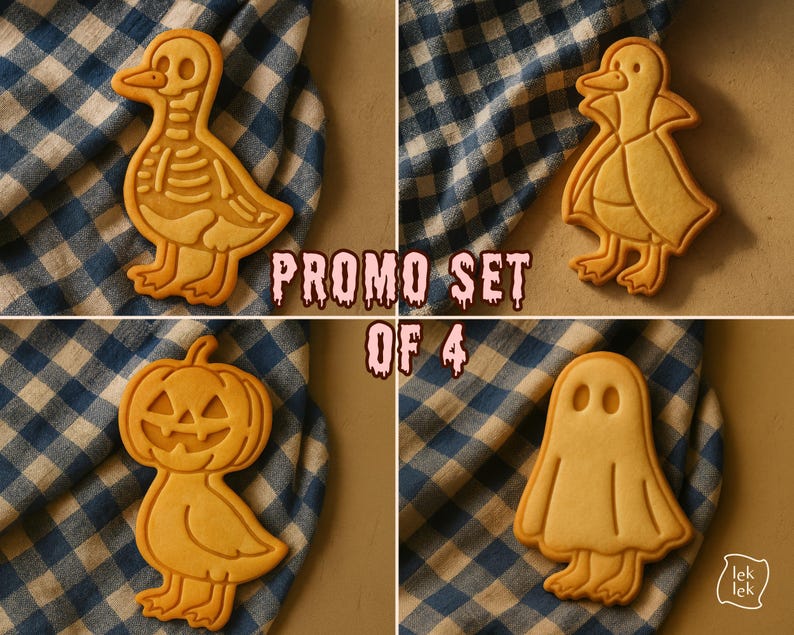 May include: A set of four Halloween-themed cookies. The cookies are shaped like a duck skeleton, a duck in a cape, a jack-o'-lantern, and a ghost. The cookies are light brown and sit on a blue and white checkered cloth. The text "PROMO SET OF 4" is visible.