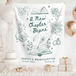 Puede incluir: Una pancarta blanca con una ilustración verde y el texto "A New Chapter Begins". El diseño incluye libros abiertos, flores y anillos. La pancarta también incluye el texto "Ashley's Bachelorette, January, 2026, Phoenix, AZ."