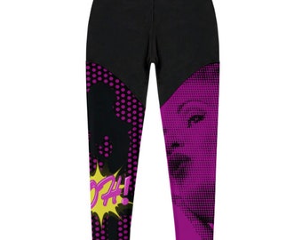 May include: Black leggings with a pink and black pop art design featuring a woman's face and the word "POW!" in a yellow speech bubble.