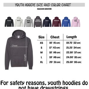 May include: A size and color chart for youth hoodies, including colors black, white, sport grey, dark heather, navy, maroon, royal, and light pink. The chart shows chest and length measurements in inches and centimeters for sizes XS to XL. Text reads: "For safety reasons, youth hoodies do not have drawstrings."