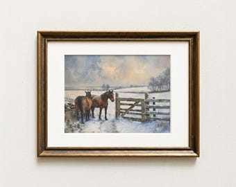 May include: Framed artwork depicting two brown horses standing in a snowy landscape. A wooden fence and stone wall are visible. The painting has a muted color palette with a focus on the horses and the winter scene.