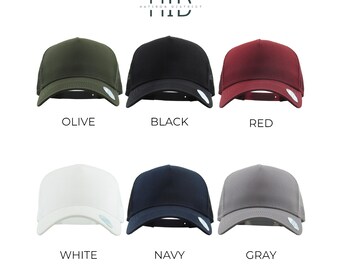 May include: Six trucker hats in different colors: olive, black, red, white, navy, and gray. The hats have a mesh back and a solid front panel. The text "Hatiron District" is written above the word "HID" in a white font.