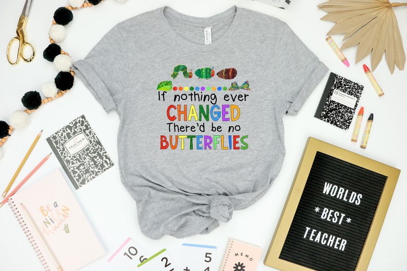 May include: Gray t-shirt with a colorful graphic that says "If nothing ever CHANGED There'd be no BUTTERFLIES".