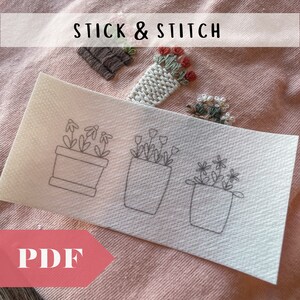 May include: A white sheet of paper with three simple line drawings of potted plants. The drawings are of a potted daisy, a potted tulip, and a potted flower with five petals. The text "STICK & STITCH" is visible at the top of the image.