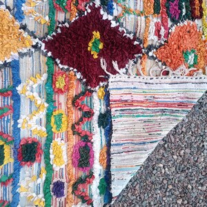 Colorful bohemian style Moroccan rug with unique tribal patterns