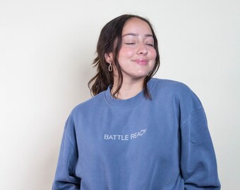 be BATTLE READY Crewneck Sweatshirt with Fearless AF on left inner sleeve Blue / Breast Cancer Survivor