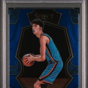 May include: A Chet Holmgren basketball card from the 2022 Select series. The card features a blue design with the player in action, holding a basketball. The card is graded a 9 by PSA and includes the text "2022 SELECT CHET HOLMGREN BLUE".