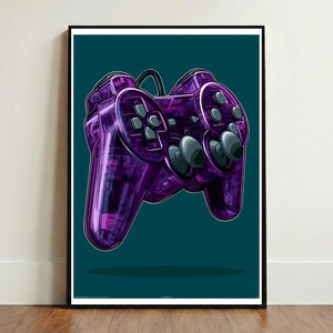 May include: A framed wall art print featuring a vibrant purple translucent video game controller. The controller displays a directional pad, two analog sticks, and various action buttons, all set against a solid dark teal background.