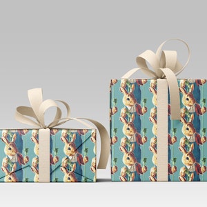May include: Two wrapped gift boxes with cream-colored ribbon bows. The boxes are covered in wrapping paper featuring a repeating pattern of a rabbit in a red jacket and blue overalls holding a carrot on a teal background. The bows are tied around the boxes.