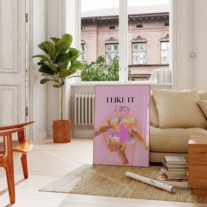 May include: Pink poster with the text "I like it dirty" and a graphic of four hands holding up cocktails.