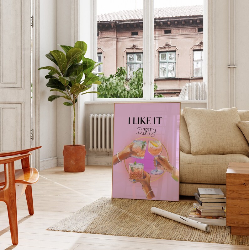 May include: Pink poster with the text "I like it dirty" and a graphic of four hands holding up cocktails.