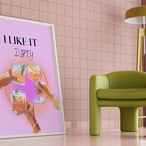 May include: A pink poster with the text "I LIKE IT DIRTY" and three cocktails in a circle. The cocktails are a gin and tonic, a margarita, and a cosmopolitan.