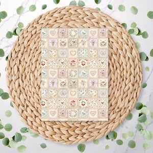 May include: A rectangular card featuring a repeating grid pattern of small squares. Each square displays soft-toned illustrations of hearts, birds, mushrooms, floral bouquets, and striped motifs in muted shades of pink, blue, green, and cream.