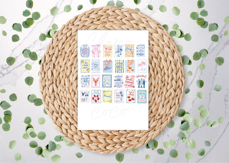 May include: A white card featuring colorful illustrations of beach-themed images, including cocktails, fish, and fruit. The card is placed on a woven, circular placemat, surrounded by green leaves. The word "Coco" is written in cursive.