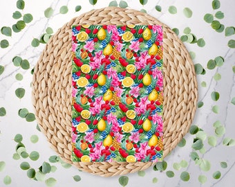 May include: A seamless pattern featuring a tropical fruit and flower design. The pattern includes lemons, pineapples, strawberries, and pink flowers on a white background.
