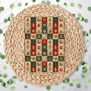 May include: A rectangular card featuring a grid pattern of festive Christmas icons including gingerbread men, candles, ornaments, stars, and mistletoe in shades of red, green, and cream, displayed on a round, woven, light brown straw placemat.