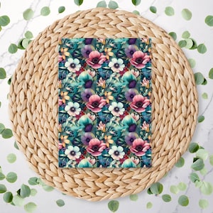 May include: A floral pattern with pink, white, and purple flowers on a dark teal background. The pattern is on a woven placemat.