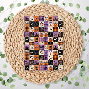 May include: A rectangular sheet featuring a repeating grid pattern of Halloween-themed squares. The design includes illustrations of orange pumpkins, black cats, ghosts, bats, spiders, and purple plaid motifs in a vibrant seasonal colour palette.