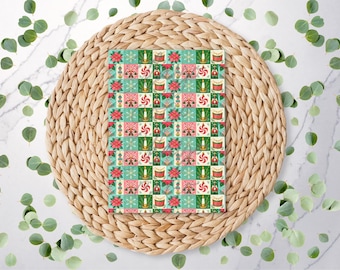 May include: A rectangular card featuring a repeating grid pattern of Christmas icons including red poinsettias, white candles, red and white peppermint swirls, and red drums, set against alternating light green and dark green squares.