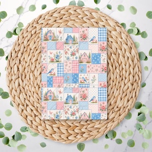 May include: A rectangular card featuring a patchwork design of alternating squares. The pattern includes illustrations of small houses, blue birds, pink and blue floral arrangements, and checkered or polka dot textures in soft pastel pink and blue tones.