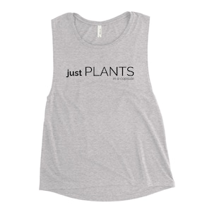 May include: A gray sleeveless muscle tank top with the text "Just Plants in a capsule" printed in black.